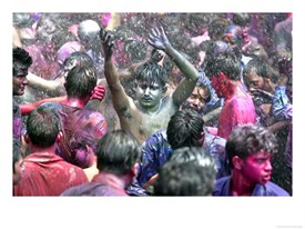 Indians, Faces Smeared with Color and Glitter, Celebrate Holi