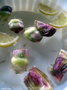 Artichokes in water with lemon on Flickr
