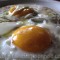 Fried eggs with red onion and cheese