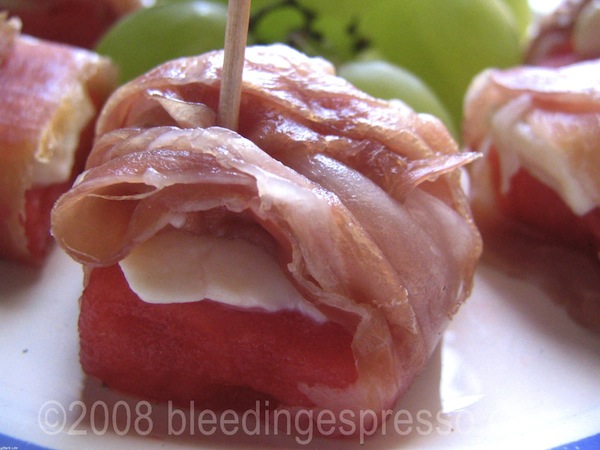 Prosciutto wrapped watermelon with bel paese cheese